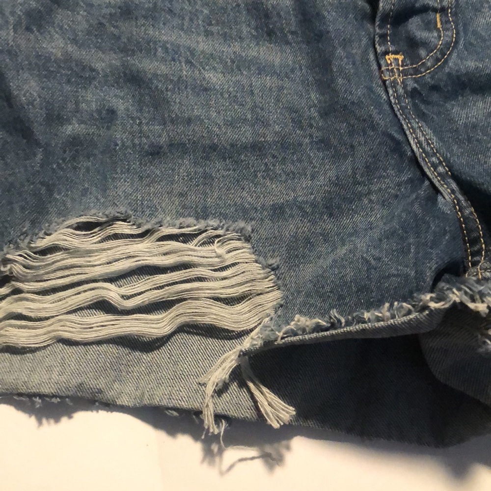 Woman’s distressed high rise button fly Jean shorts - Picture 5 of 9
